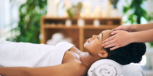 A business owner is relaxing, taking some time off and enjoying a massage.