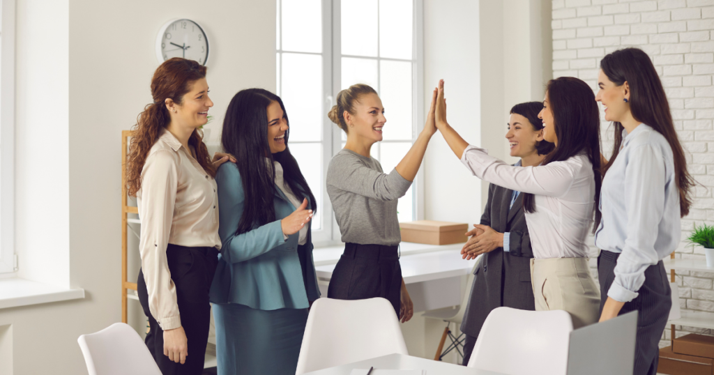 A small business team celebrating their search engine optimization wins.